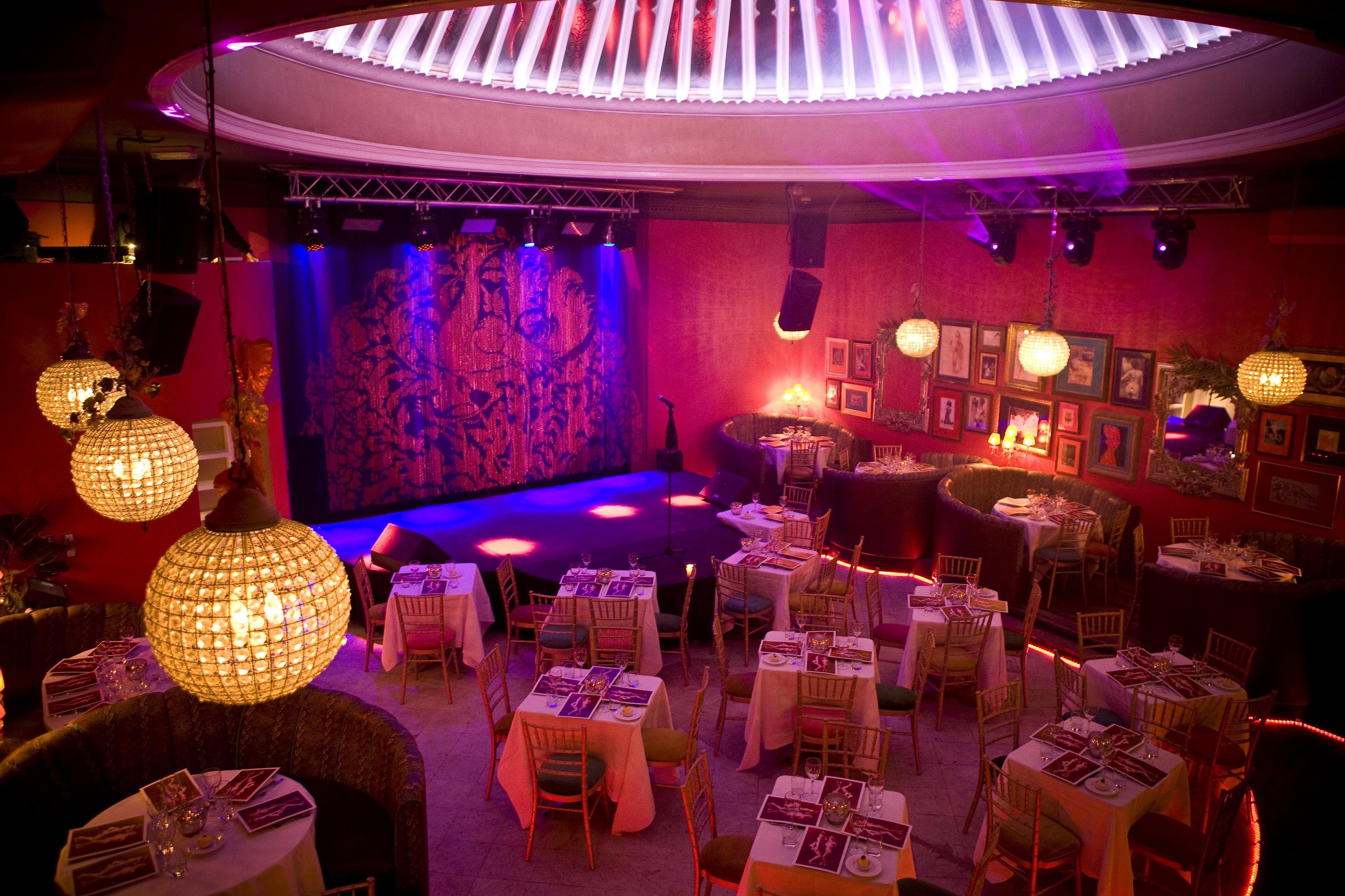 Vibrant event space at Proud Cabaret Brighton with stylish seating for intimate gatherings.