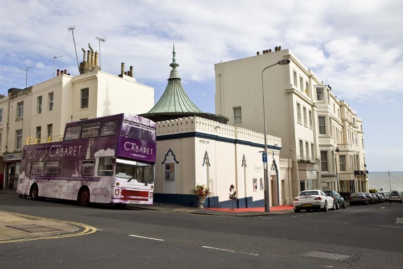 Vibrant Proud Cabaret Brighton venue with double-decker bus, ideal for events and meetings.