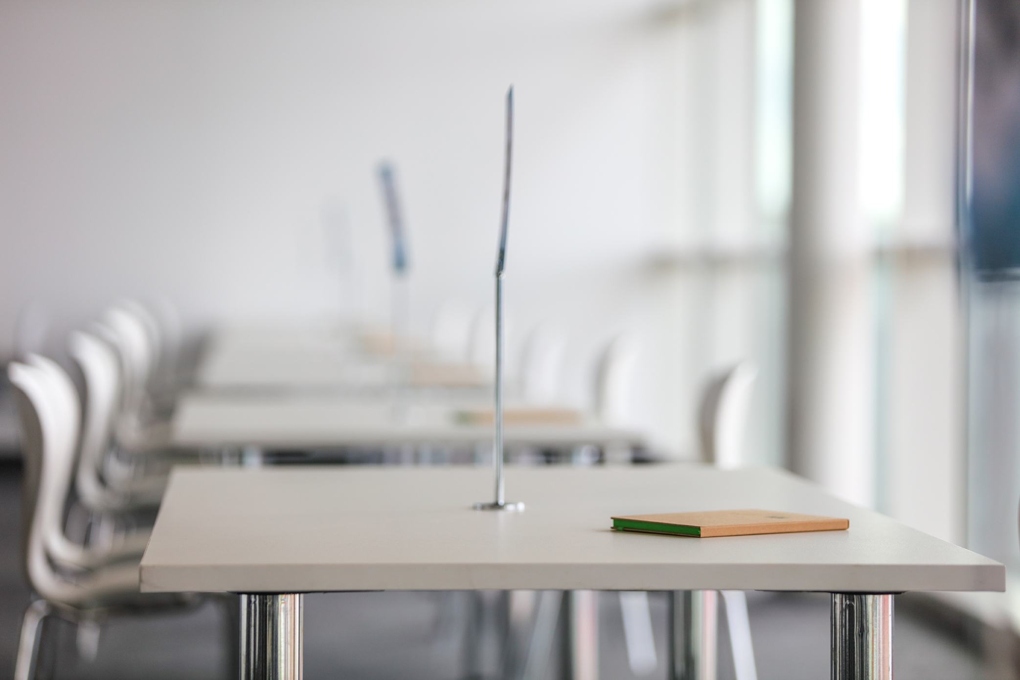Modern meeting space in Silverstone for workshops and seminars, featuring arranged tables.