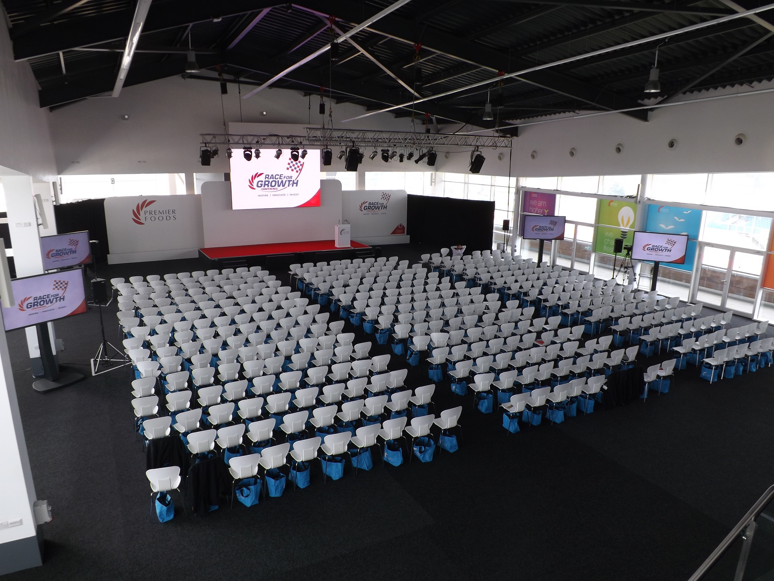 Hall 5 at Silverstone: spacious conference setup with white chairs for engagement.