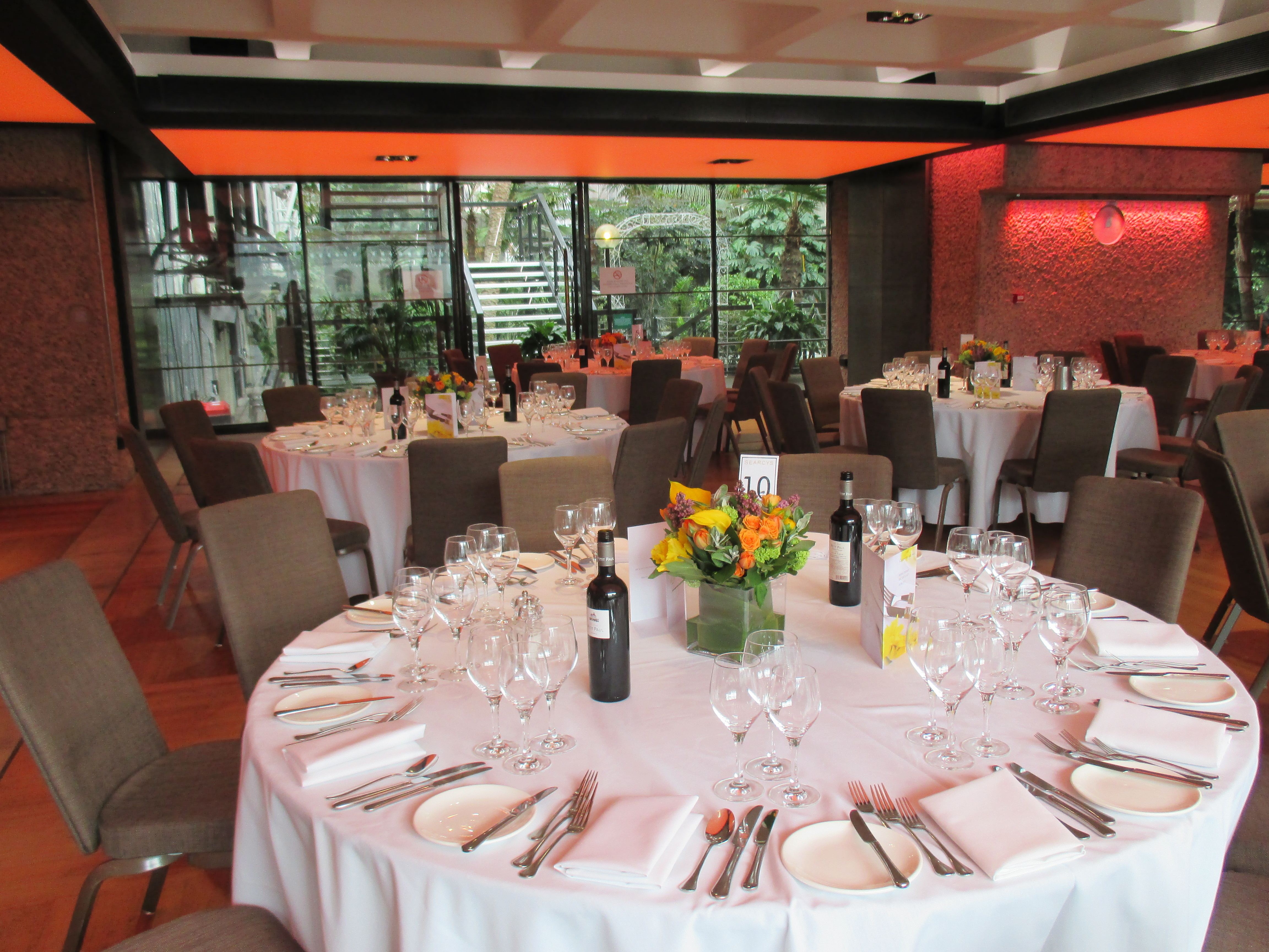 Elegant dining setup in The Garden Room, Barbican Centre for corporate events and galas.