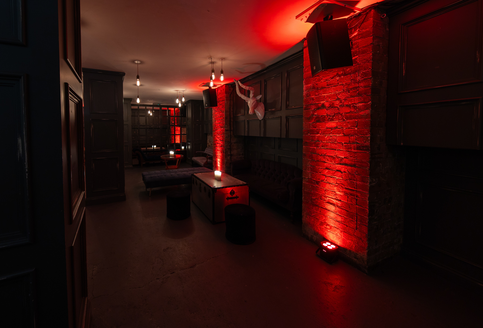 Stylish dimly lit event space at The Secret Bar, perfect for networking and private gatherings.