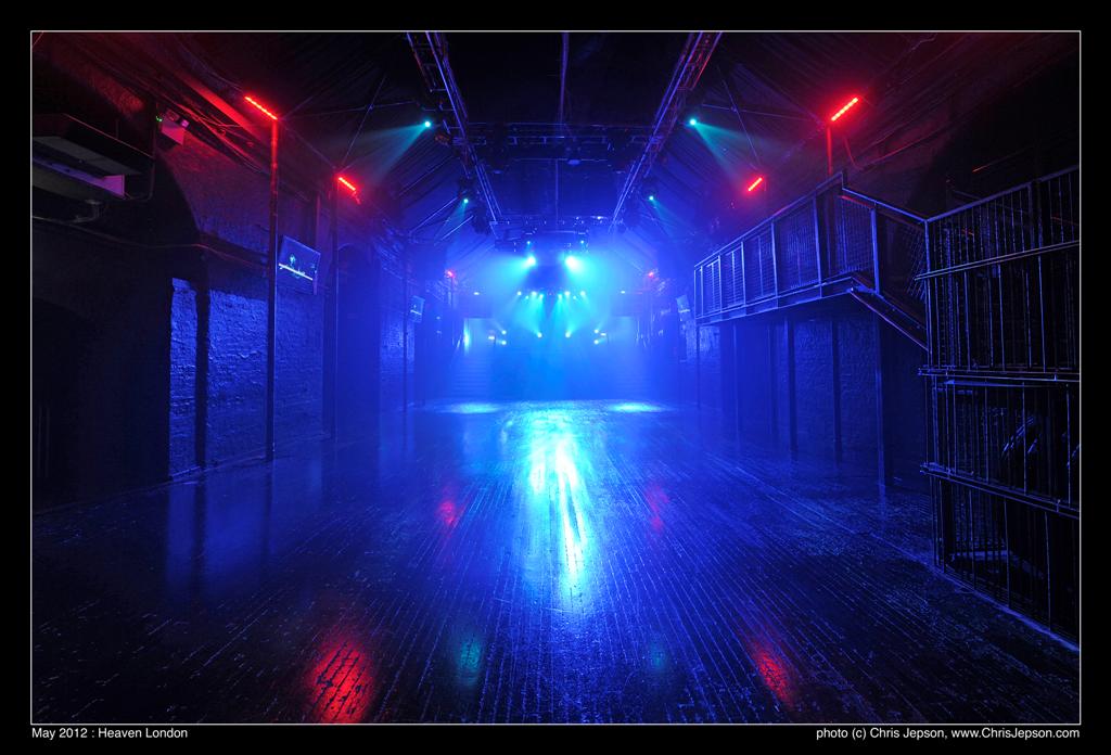 Versatile event space with dramatic lighting, perfect for corporate events and parties.
