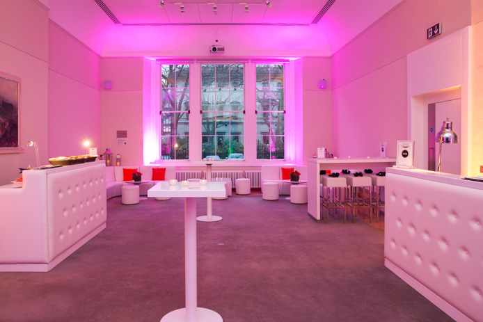 Sir Kirby Laing in a stylish event space with modern furniture, ideal for networking events.