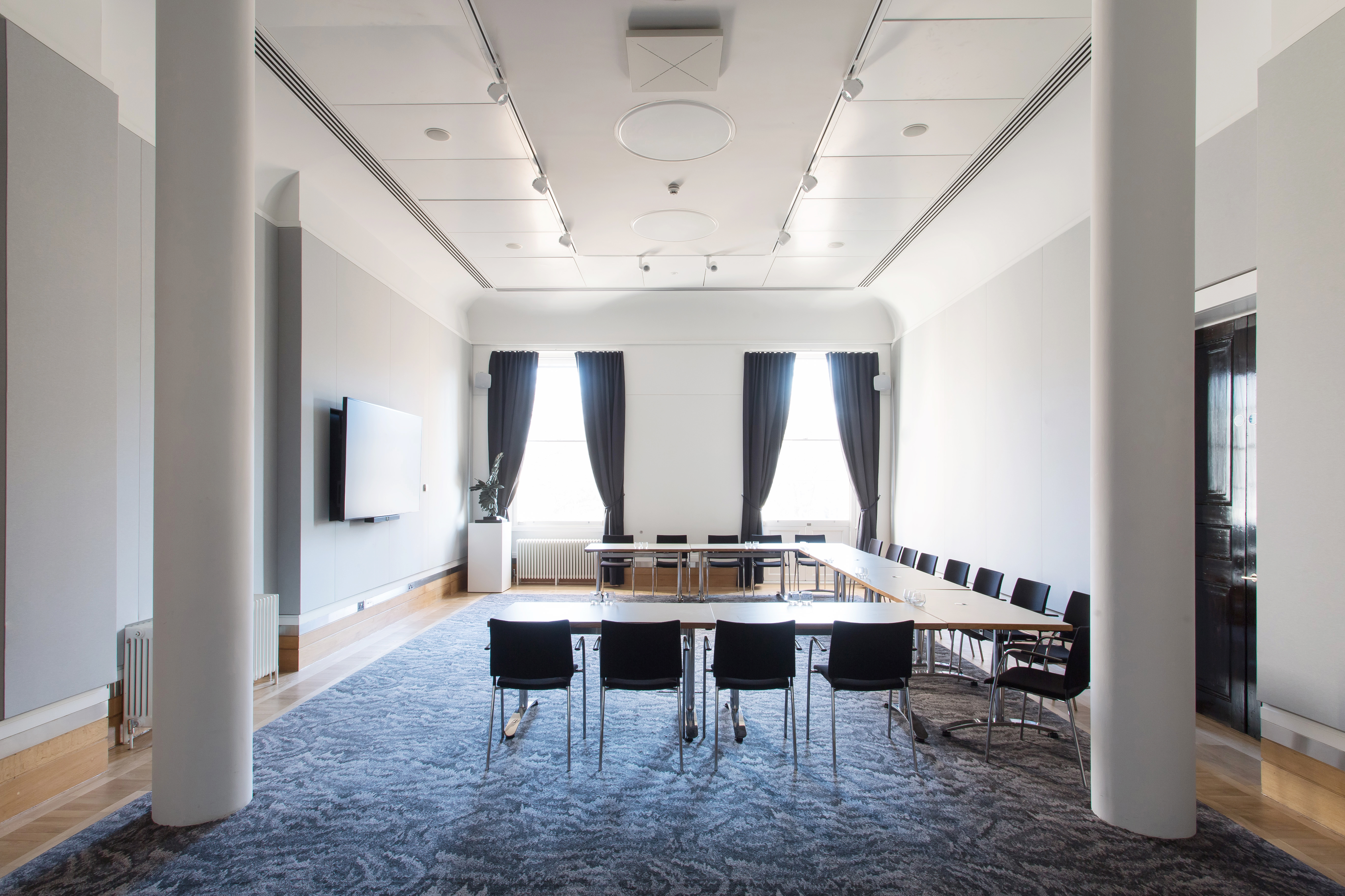 Modern meeting room at National Grid, featuring a long table for workshops and board meetings.