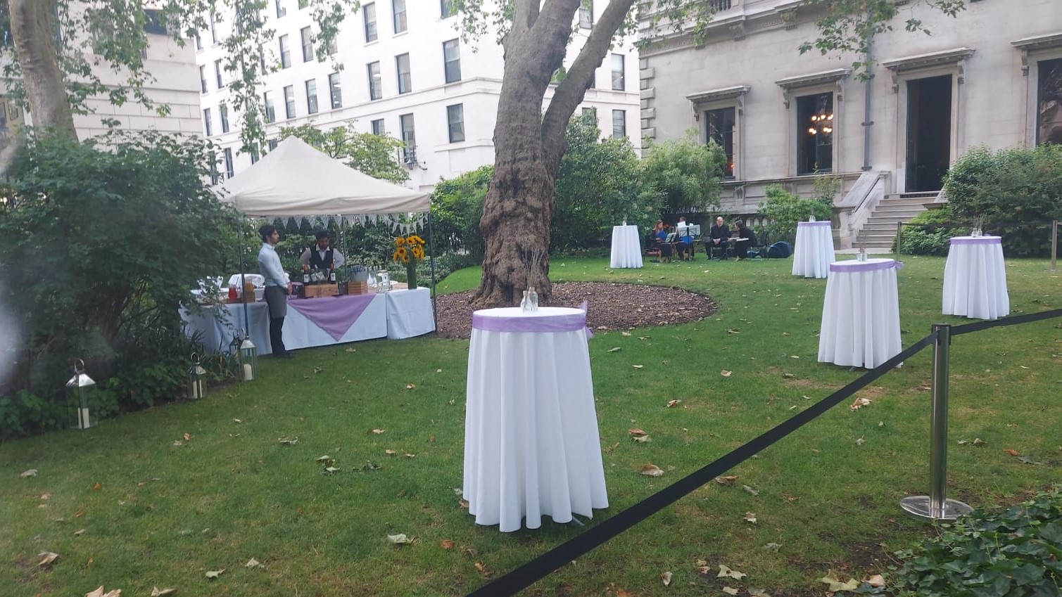 Elegant outdoor event setup at Prince Philip House with lavender accents and lush greenery.