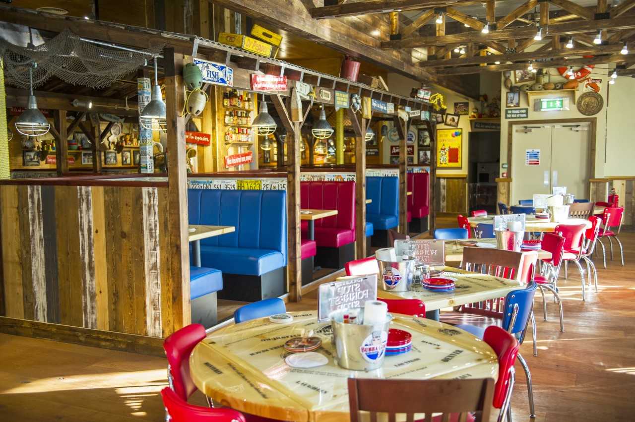 Rustic dining venue with colorful seating, ideal for casual gatherings and events.
