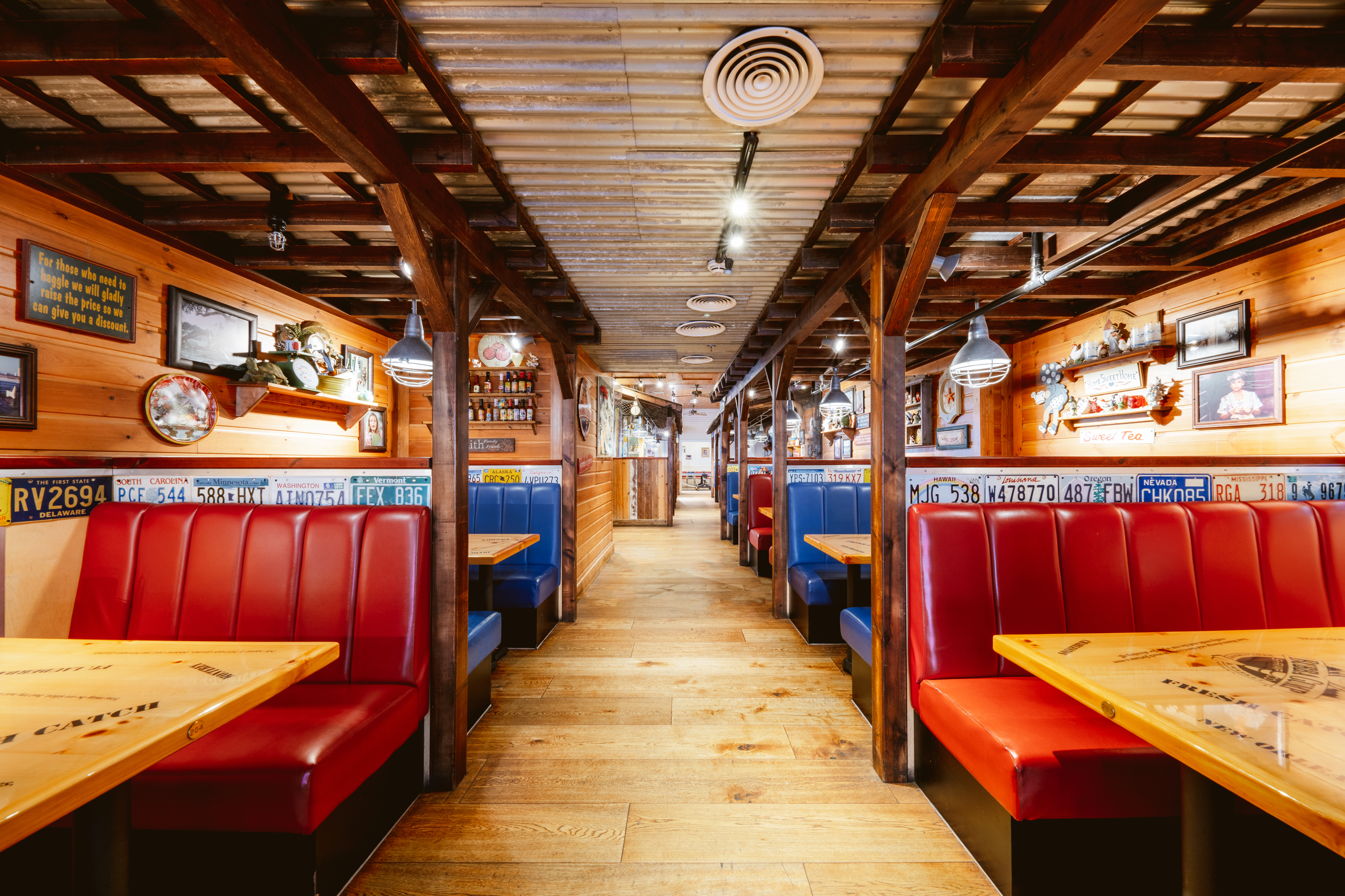 Rustic dining venue with colorful booths for casual gatherings and team-building events.