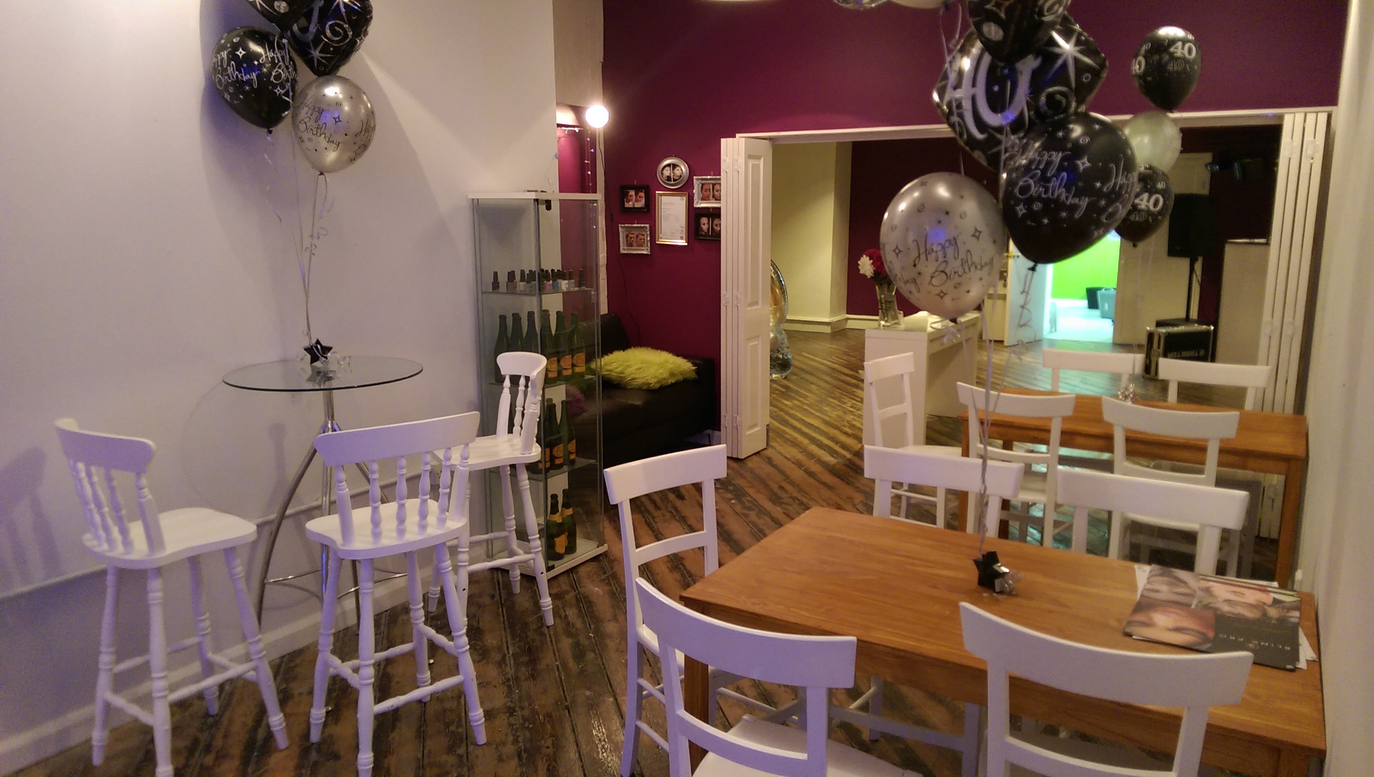 Cozy event space with purple walls, perfect for intimate parties and meetings.