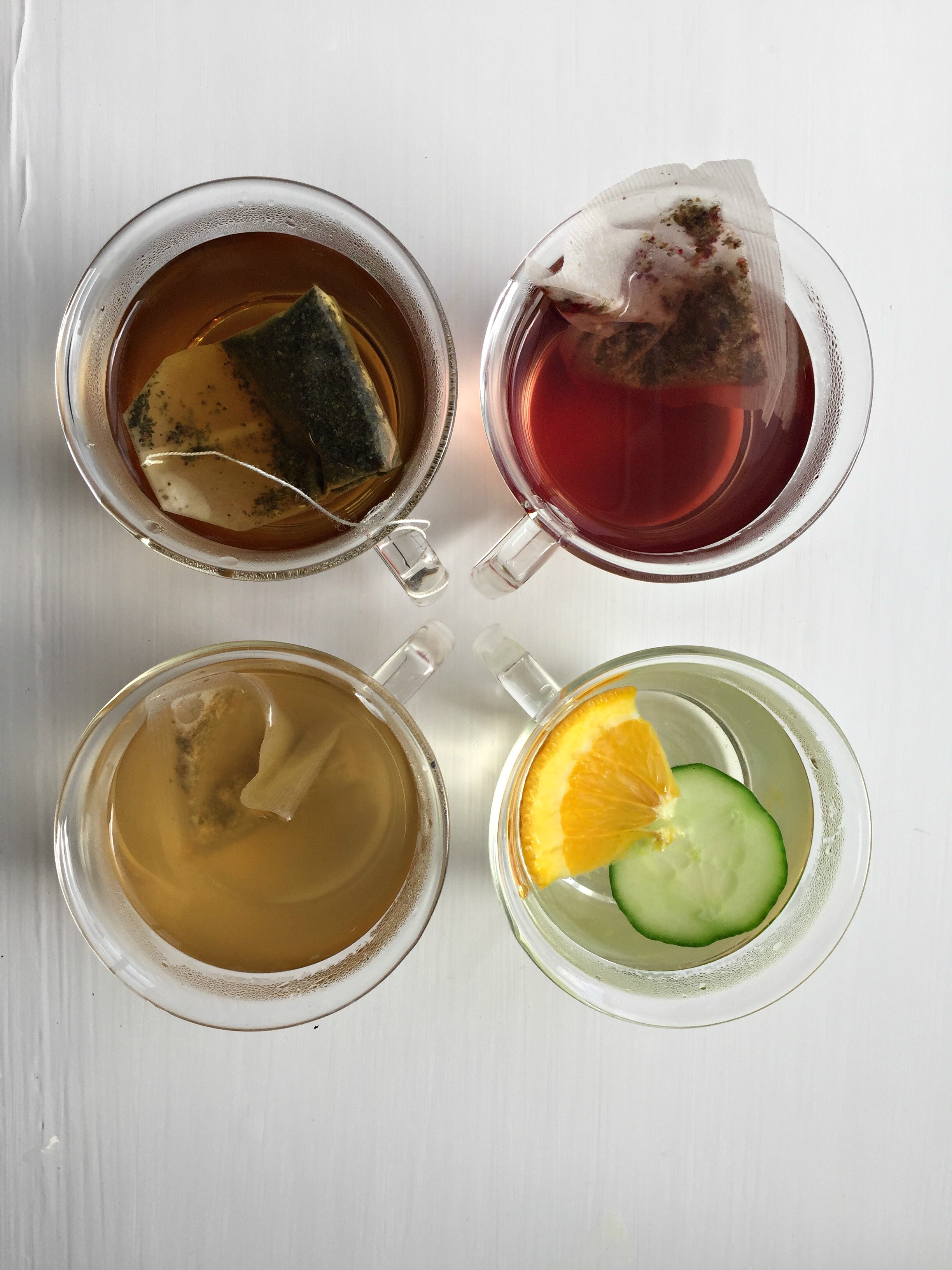 Vibrant teas in glass cups at Hemingway GreenSpace for wellness events and networking.