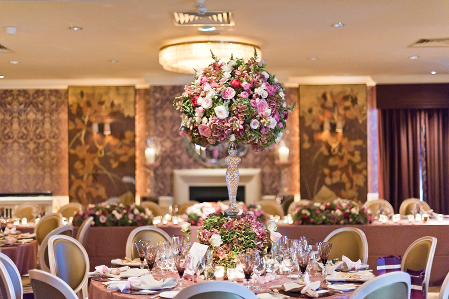 Elegant banquet table with floral centerpiece at Chewton Glen Hotel for weddings.