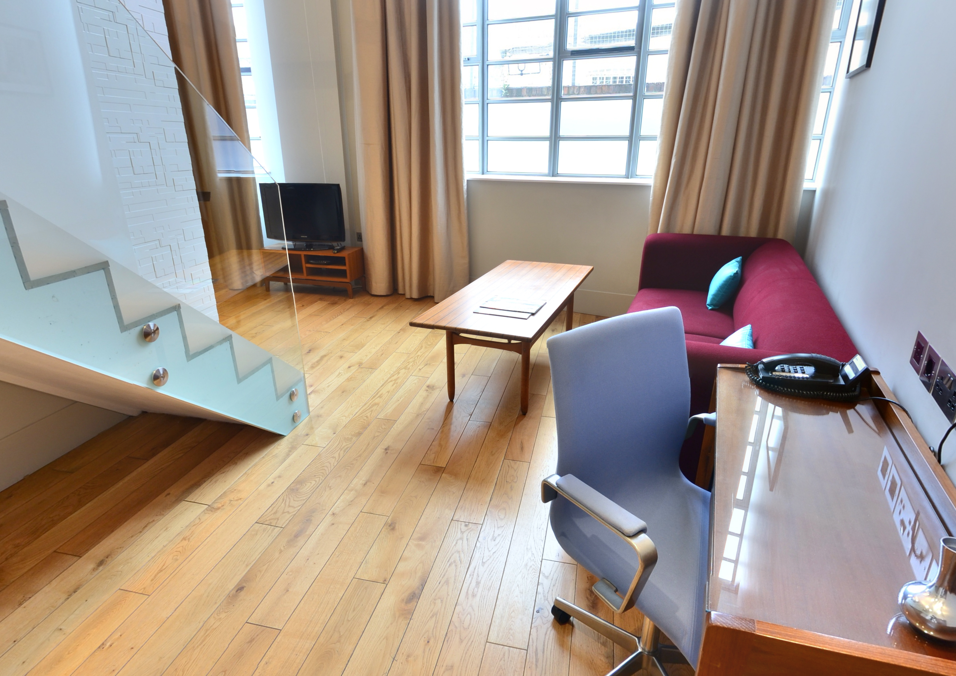Modern meeting space with wooden flooring at Town Hall Hotel for collaborative events.