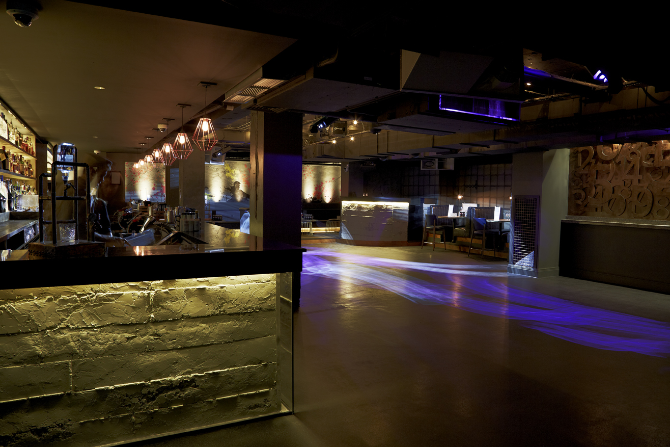 Modern event space in Club Forge with ambient lighting for receptions and networking.