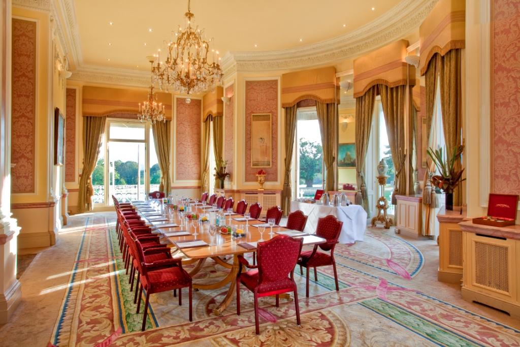 Elegant meeting room with natural light at Stoke Park for corporate events and receptions.