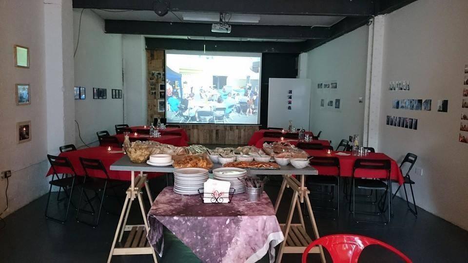 Centrala Gallery event space with buffet setup, perfect for meetings and social gatherings.