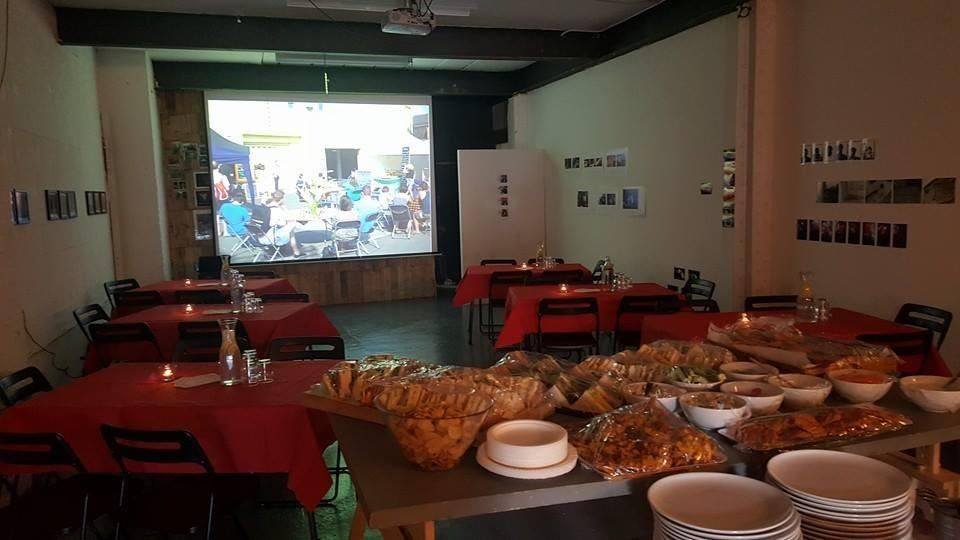 Centrala Gallery event space with red tablecloths and buffet setup for engaging gatherings.
