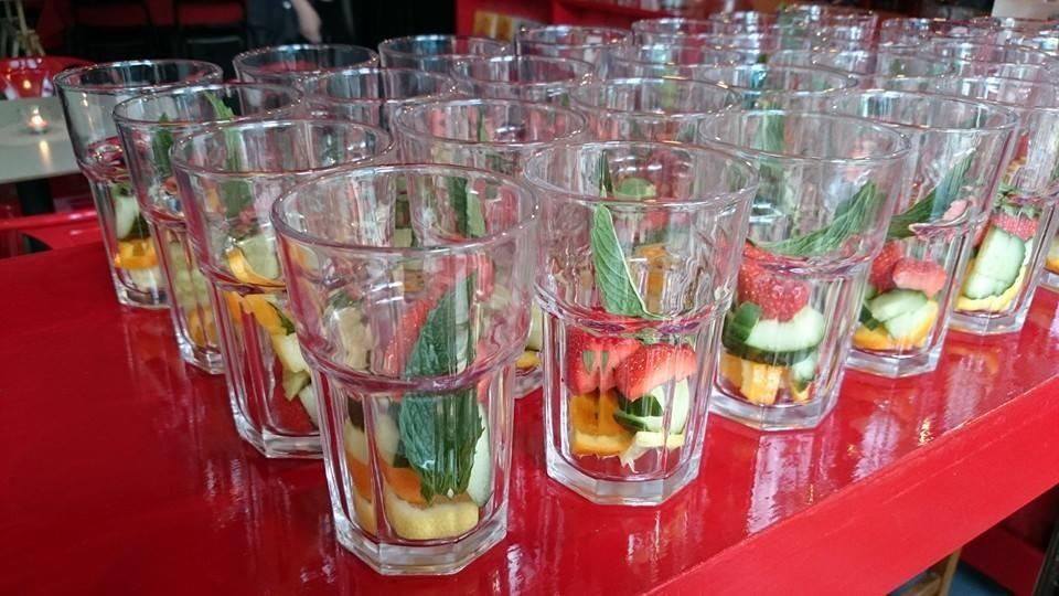 Centrala Gallery event space with vibrant fruit beverage shots for networking and wellness events.