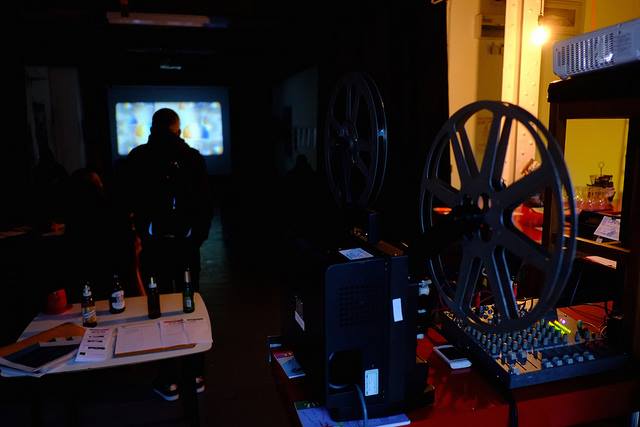 Centrala Gallery event space with vintage projectors for intimate film screenings.