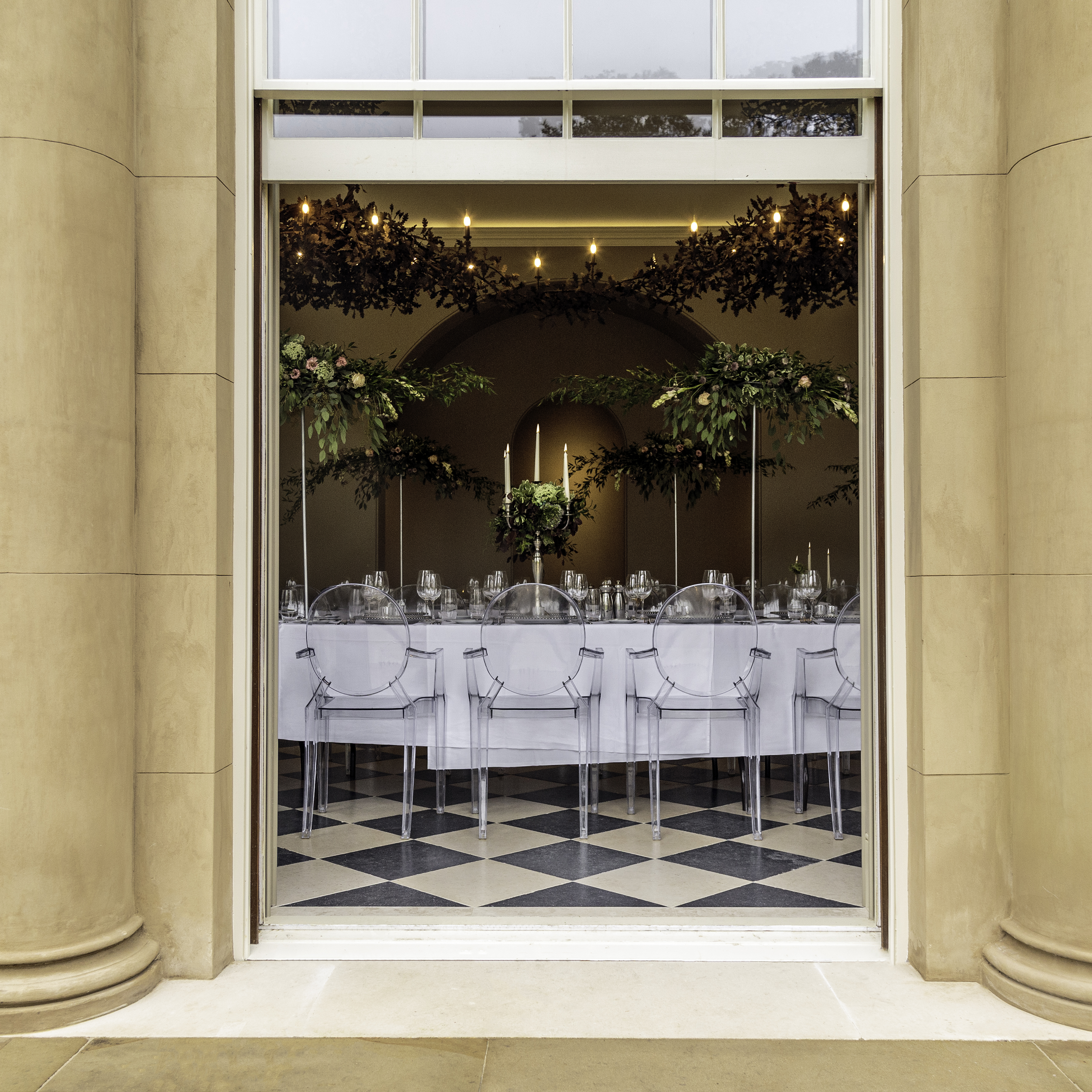 Elegant event space at Exclusive Use Manor House with modern table setting and floral decor.