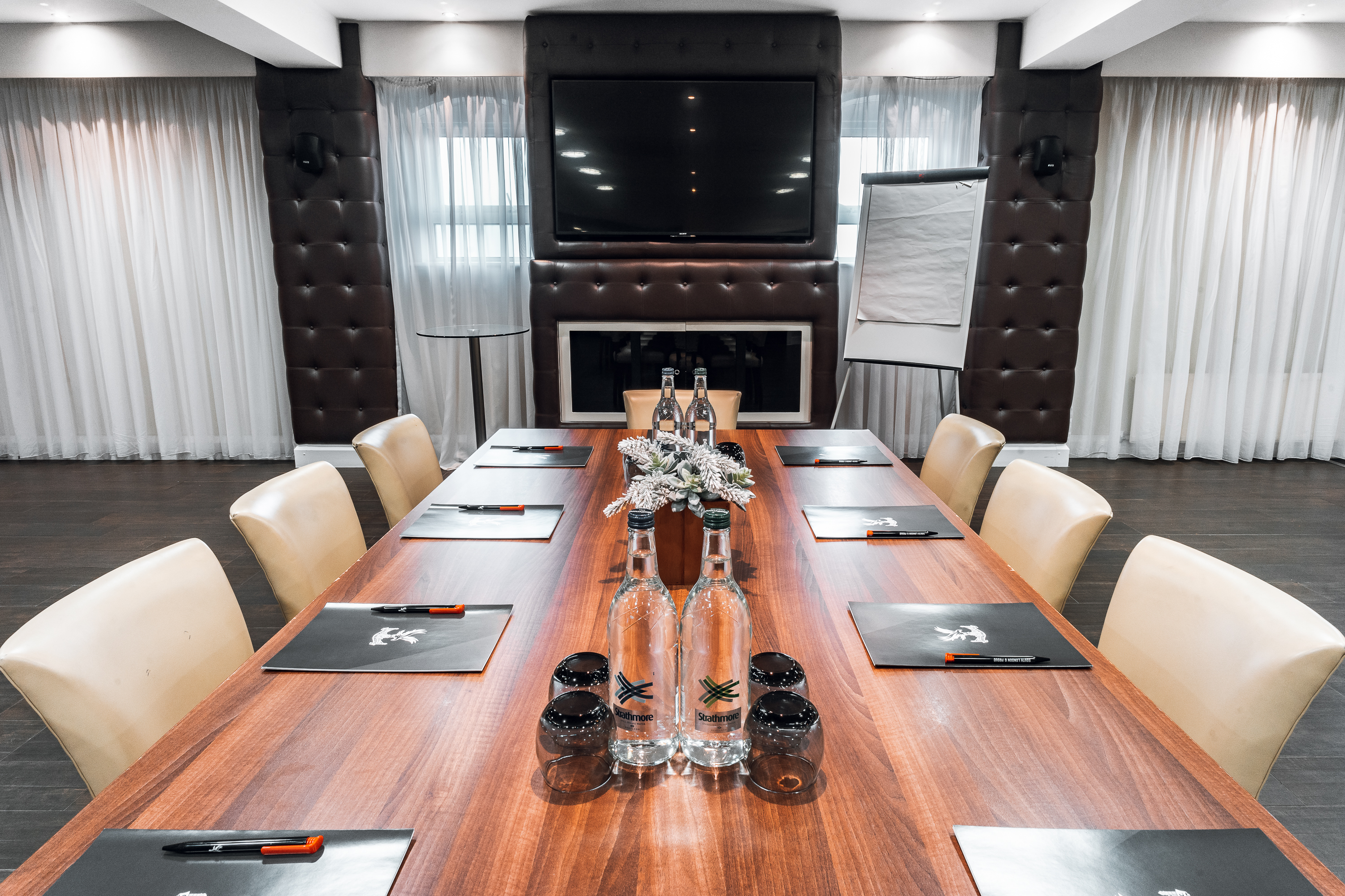 Boardroom at Selhurst Park Stadium, featuring a long wooden table for corporate meetings.