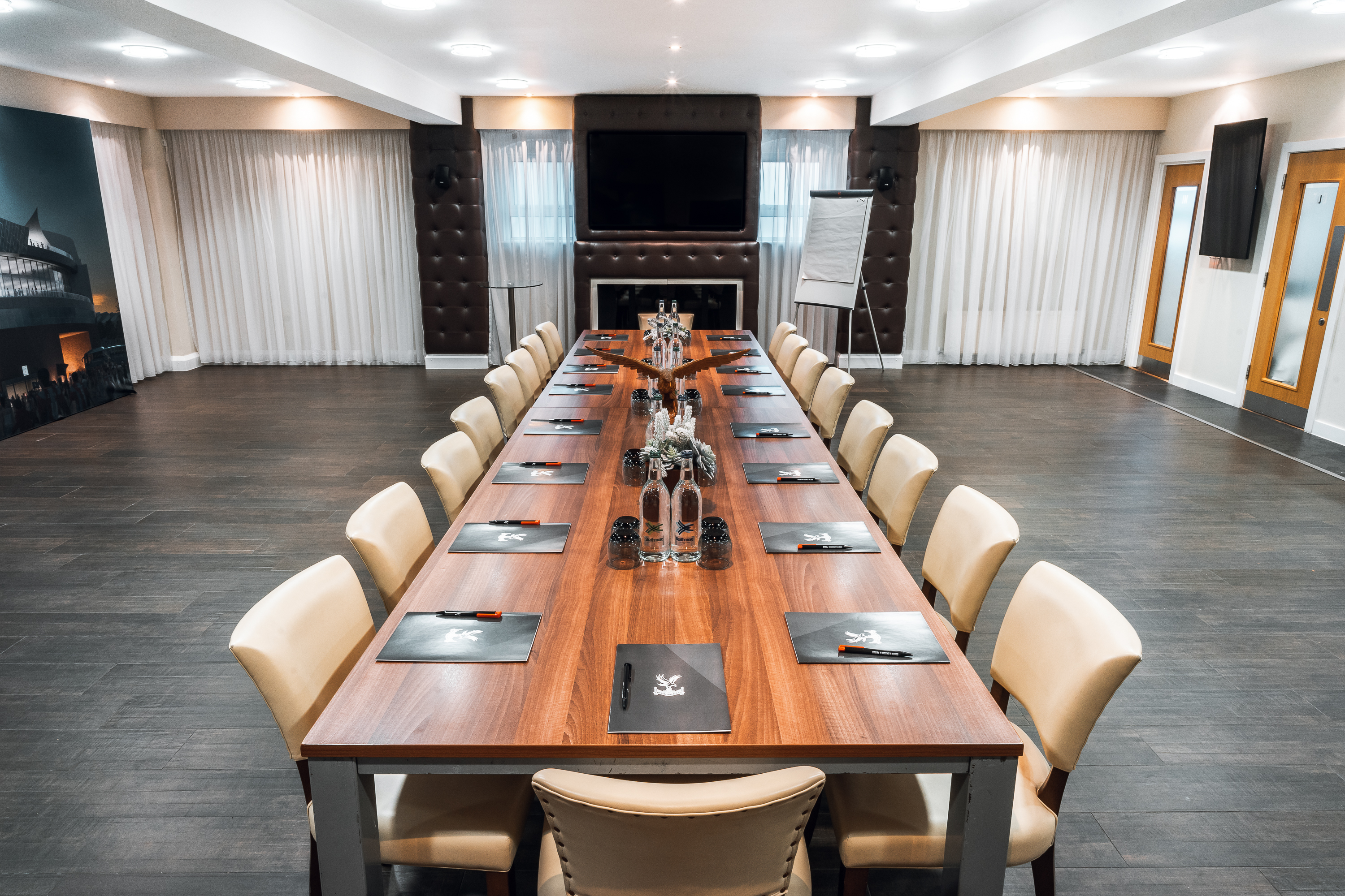 Boardroom at Selhurst Park Stadium with polished table, ideal for corporate meetings.