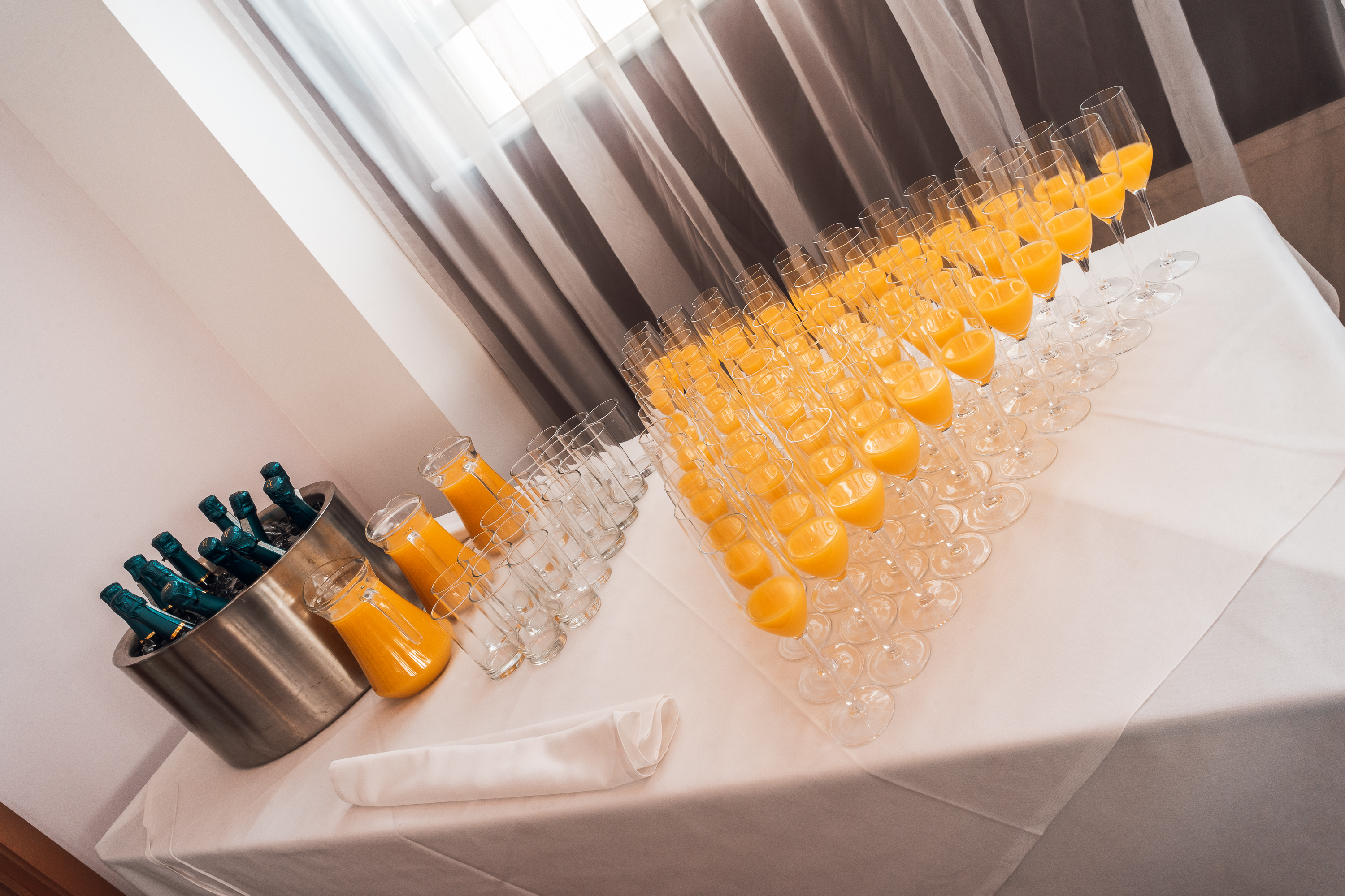 Stanley Stephenson Lounge with champagne flutes, perfect for brunch or networking events.