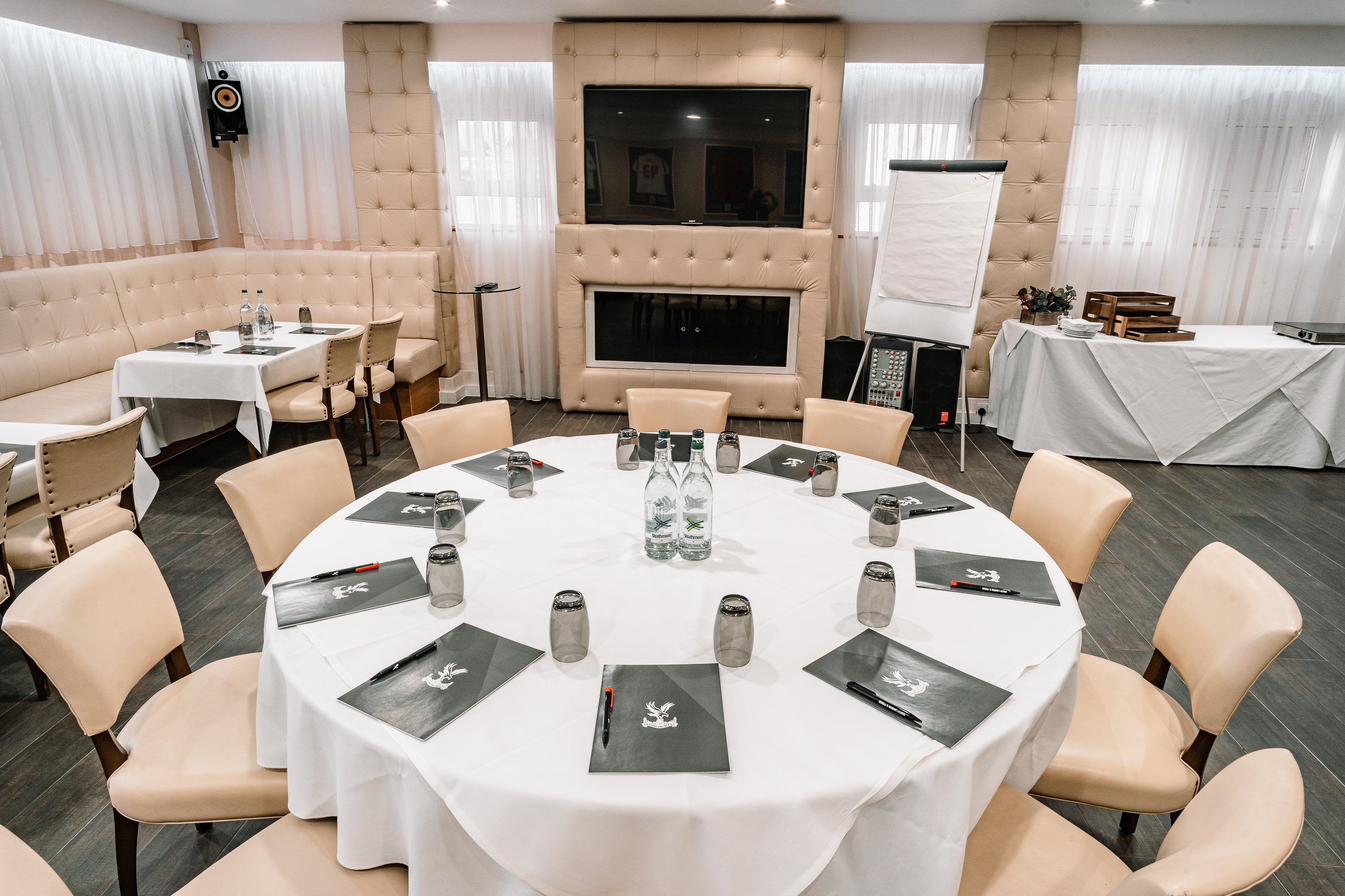 Vice President's Lounge at Selhurst Park, round table setup for meetings and workshops.