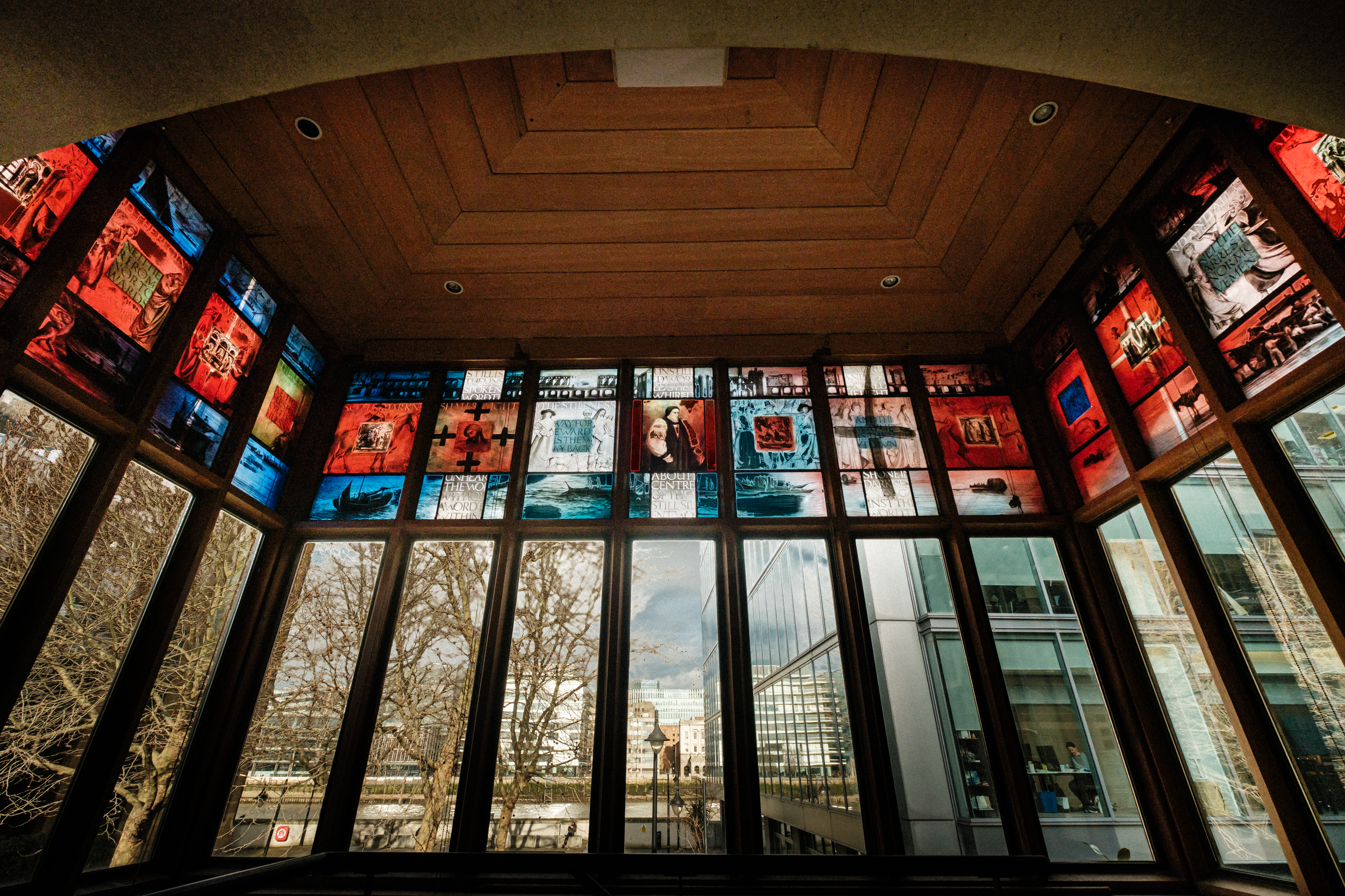 Vibrant Southwark Cathedral Library with colorful windows, ideal for networking events.