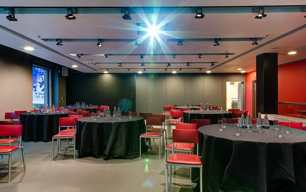 Dorfman Room at Sadler's Wells: versatile meeting space with round tables and projector.