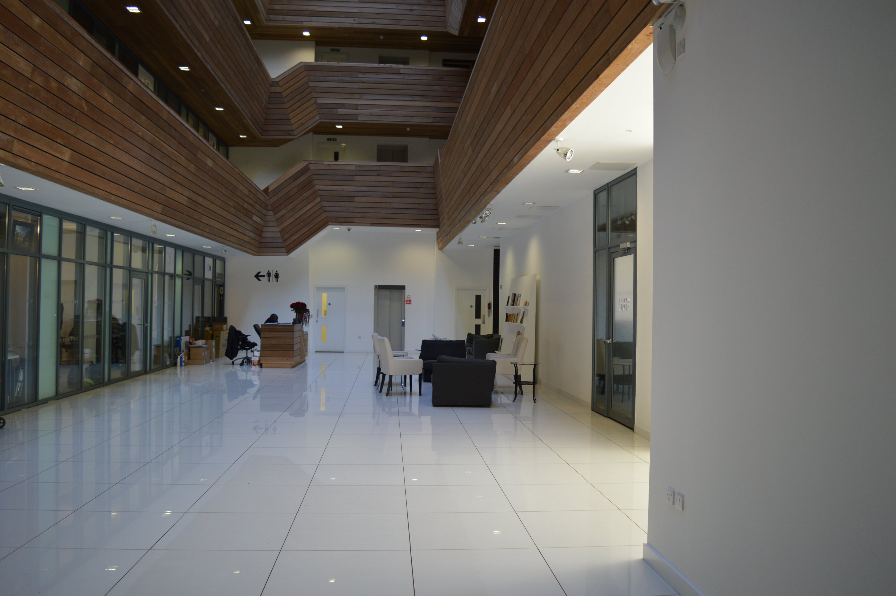 Modern Arthaus Atrium venue with sleek white floors, ideal for networking events.