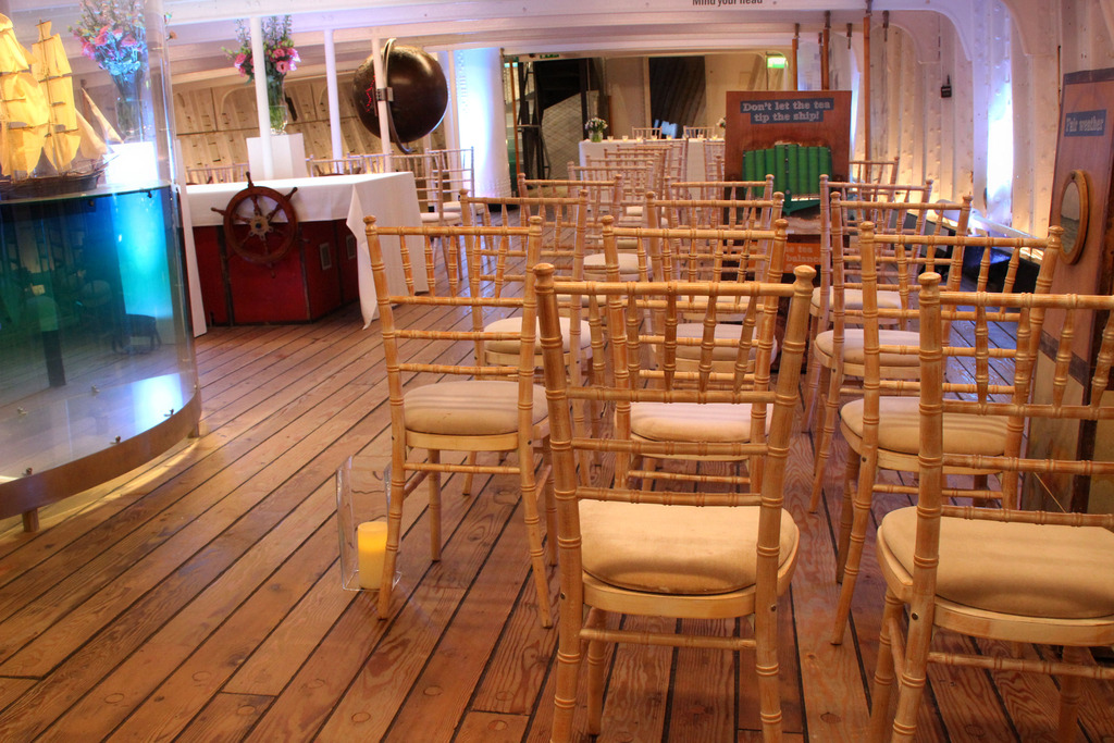 Elegant chiavari chairs in Cutty Sark's Tween Deck, perfect for events and gatherings.