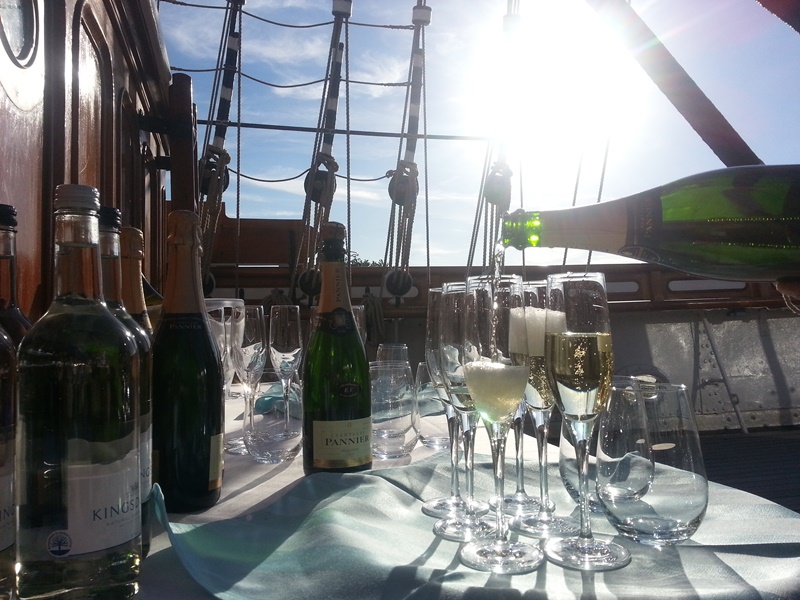 Elegant table with sparkling wines on The Weather Deck, Cutty Sark for a luxury event.