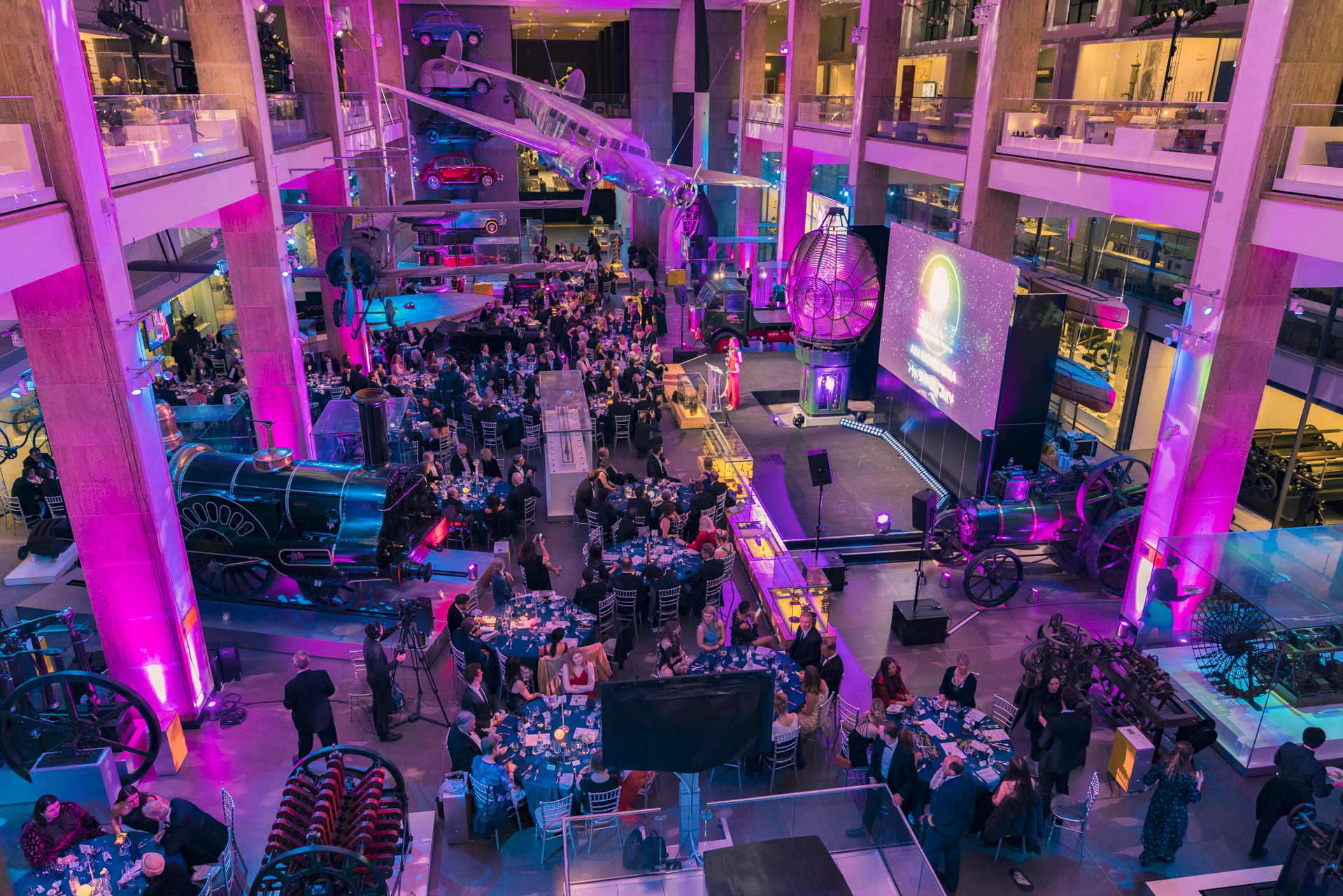 Vibrant event at The Science Museum with dynamic purple lighting and modern decor.