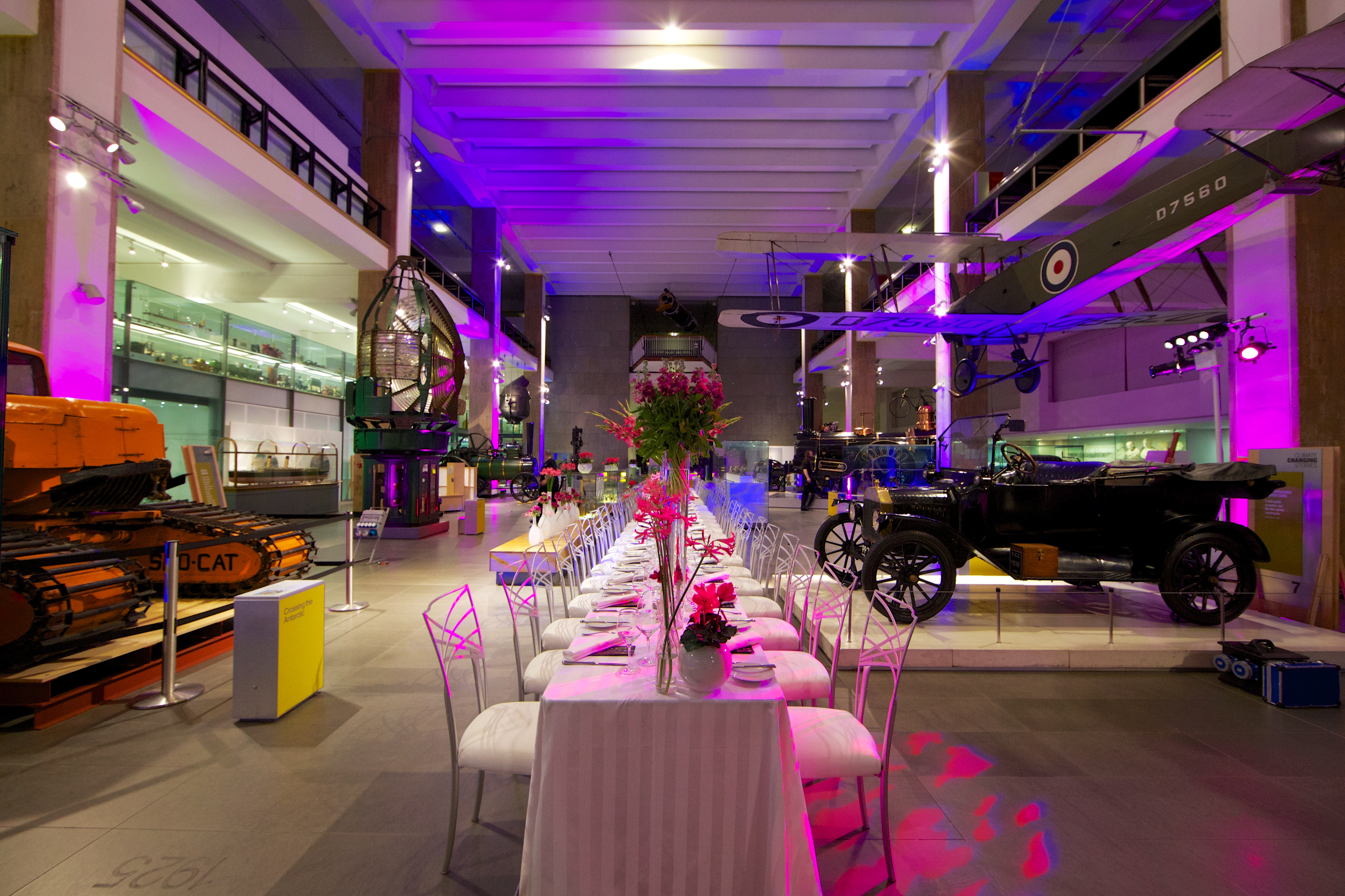 Elegant event setup with a long table in The Science Museum, perfect for corporate galas.