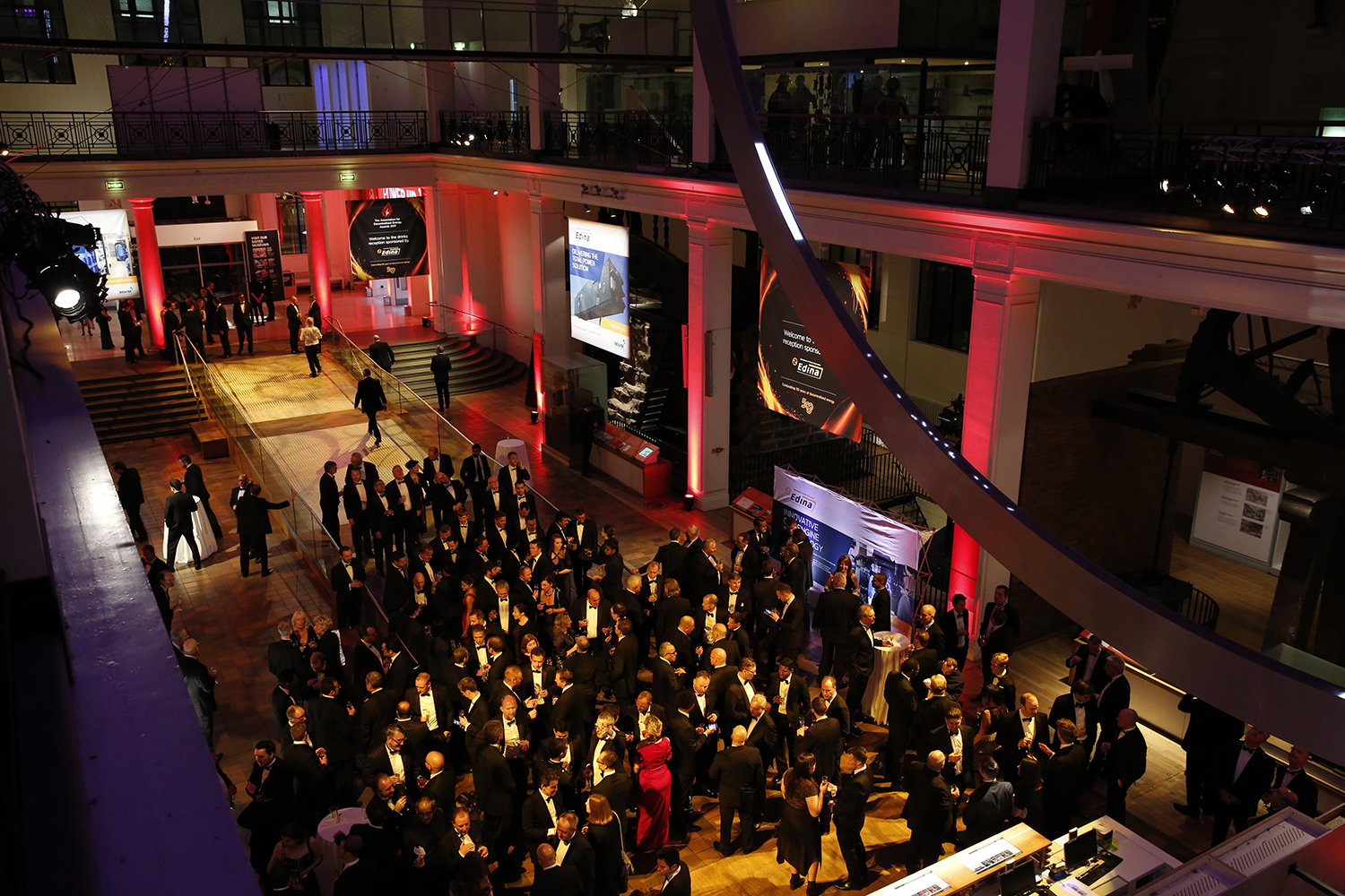 Energy Hall at The Science Museum, vibrant networking event with ambient lighting.