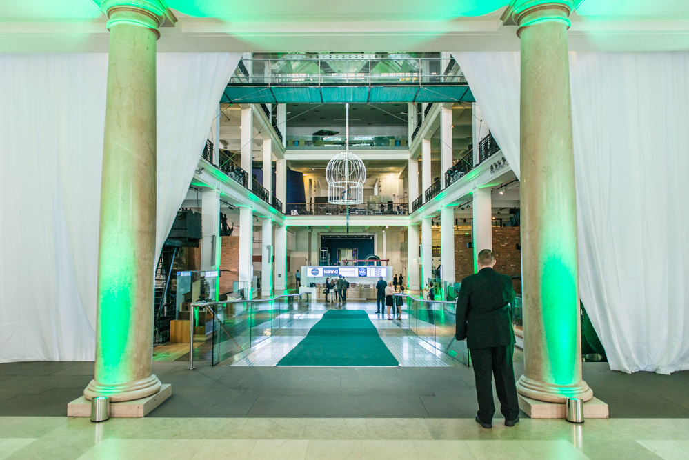 Energy Hall at The Science Museum with elegant columns and vibrant green carpet for events.