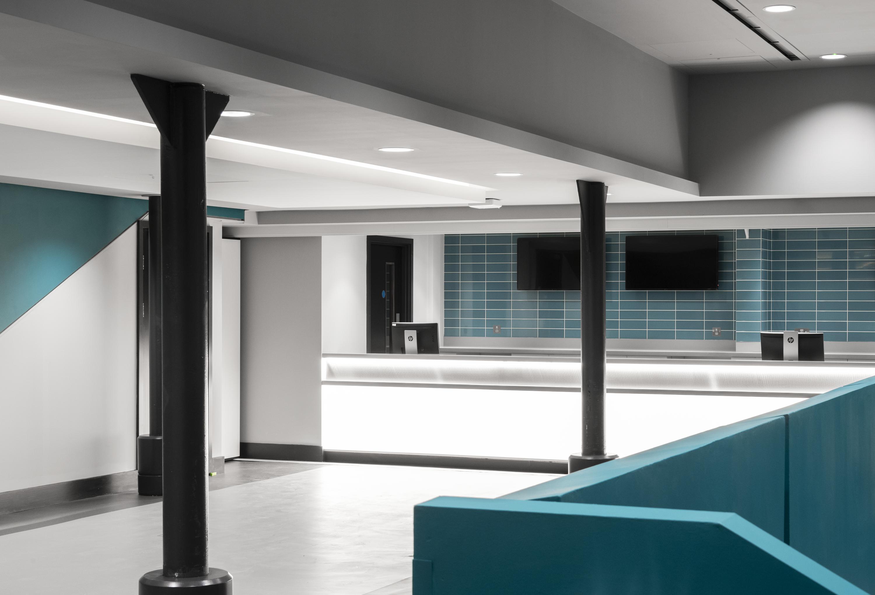 IMAX Theatre at The Science Museum, modern event space with dual screens for presentations.