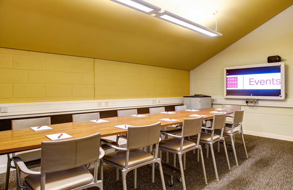 Teneisha Bonner in a bright meeting room at Cripplegate Rooms, ideal for events and presentations.