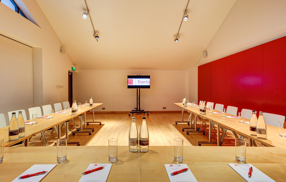 Meeting room at Sadler's Wells with U-shaped table for professional events and presentations.