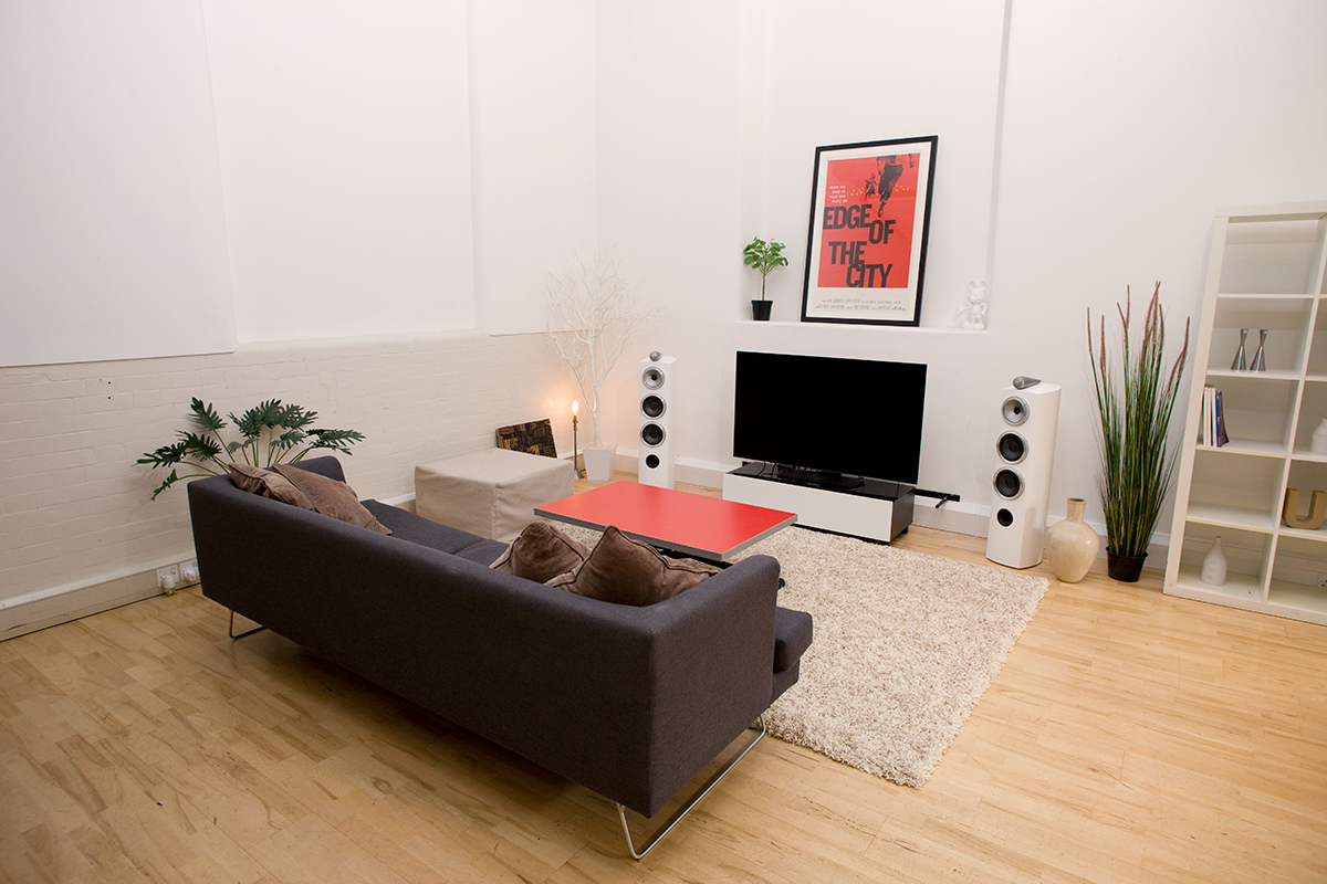 Modern minimalist meeting space with large TV for presentations and brainstorming sessions.