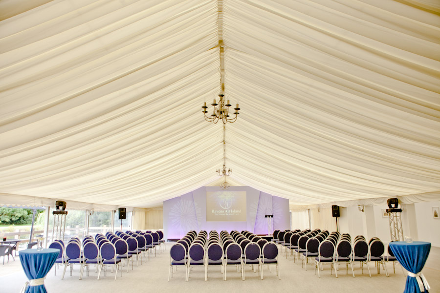Elegant event space with blue tablecloths for conferences on Ravens Ait Island.
