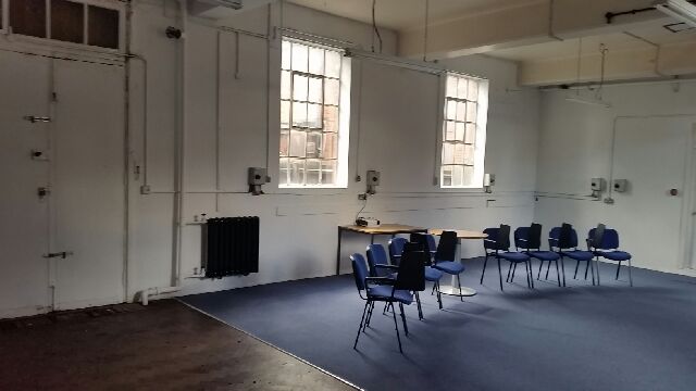 Ground Floor Classroom with blue chairs, ideal for workshops and meetings.