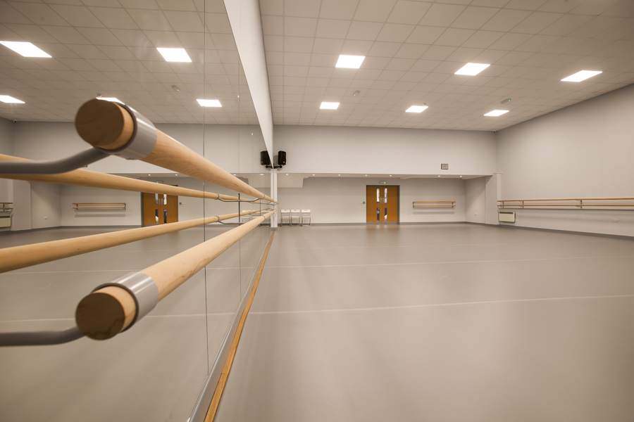 Spacious dance studio with mirrored wall, perfect for workshops and team-building events.