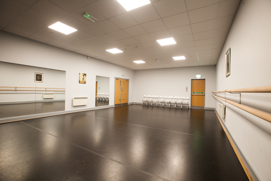 Versatile event space with mirrored walls for workshops and gatherings at Adagio School of Dance.