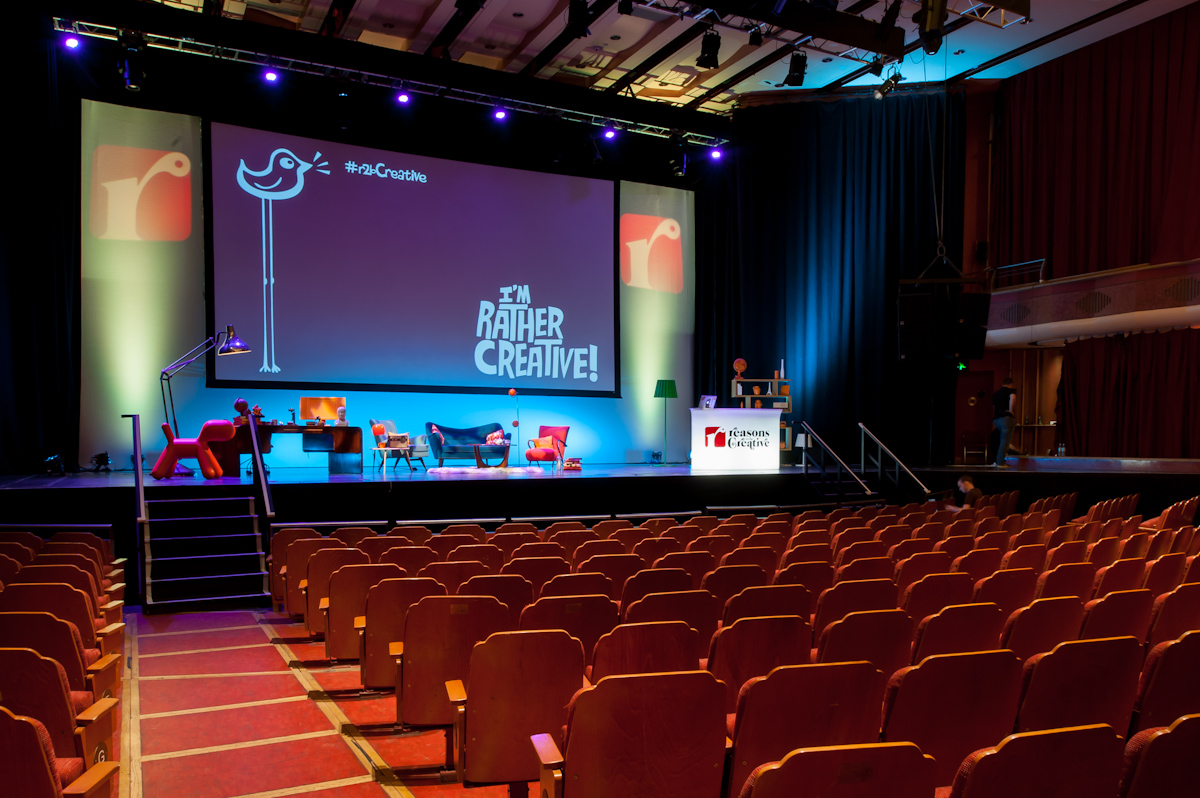 Brighton Dome Concert Hall stage with vibrant lighting for engaging presentations and events.