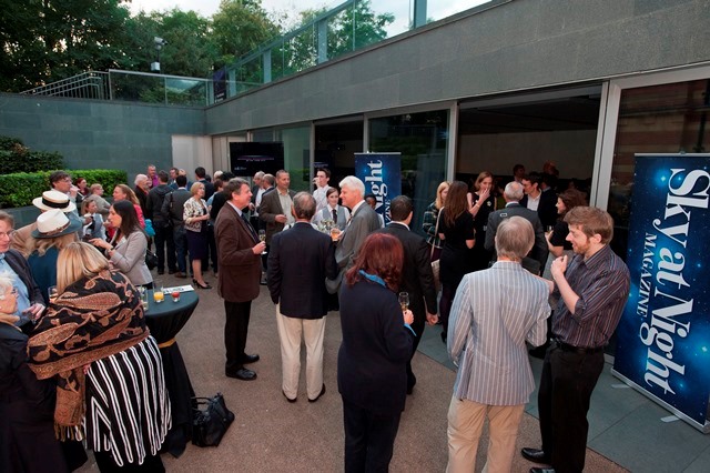 Vibrant networking event at Peter Harrison Planetarium with Sky at Night Magazine branding.