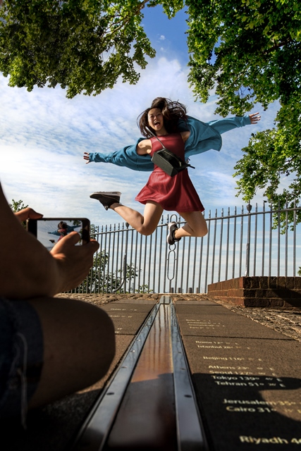 Outdoor event in The Octagon Room, Royal Observatory; vibrant jumper captures engagement.