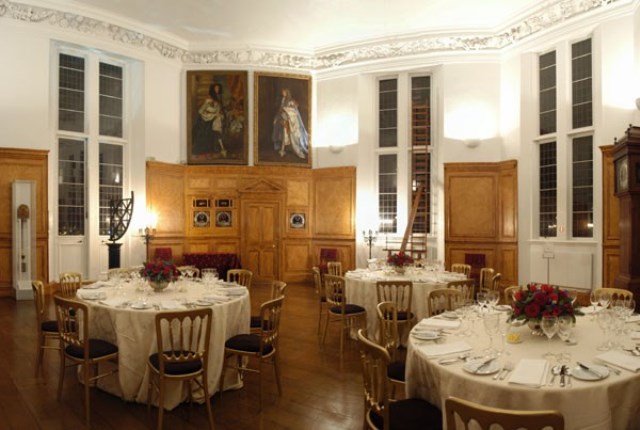 Elegant banquet room with round tables at The Octagon Room, ideal for upscale events and galas.