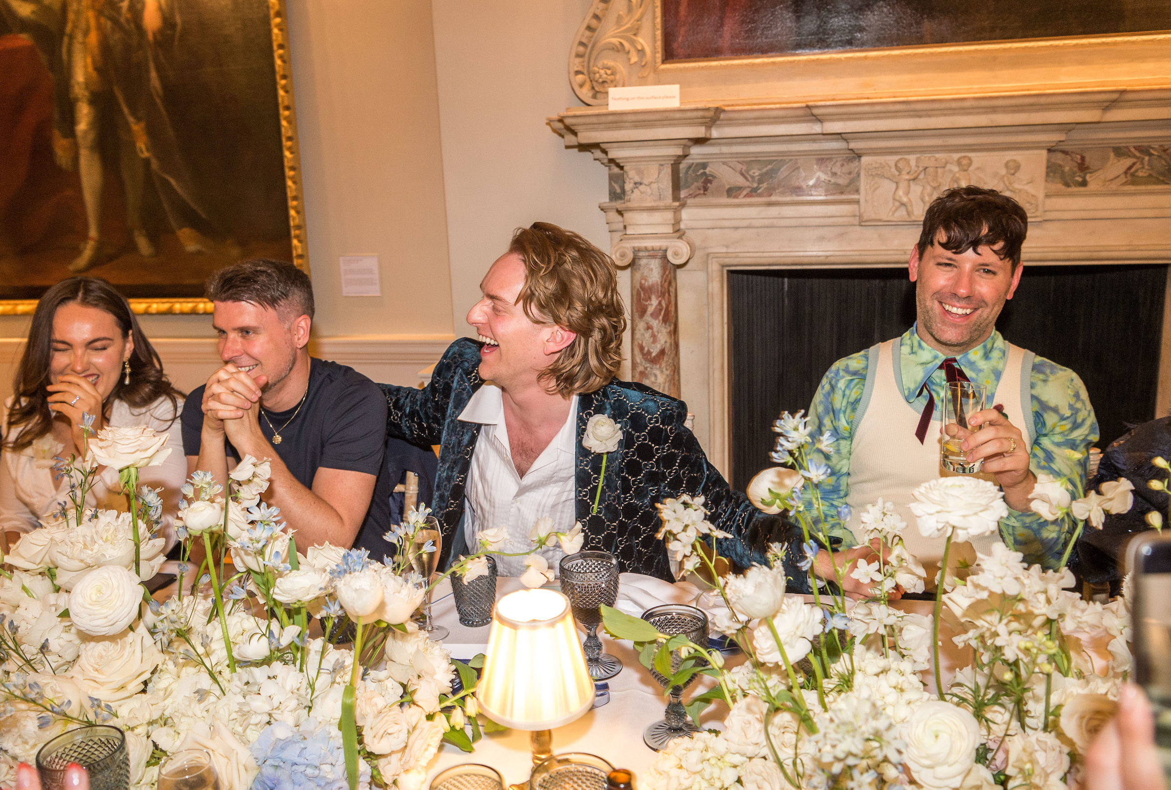 Elegant gathering at The Foundling Museum's Picture Gallery with floral decor.