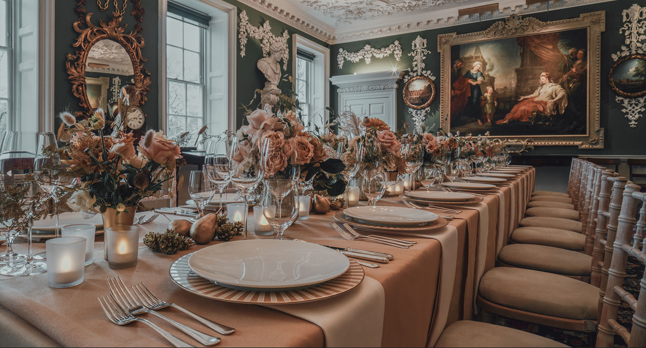 Elegant dining table with floral centerpieces in The Foundling Museum for gala events.